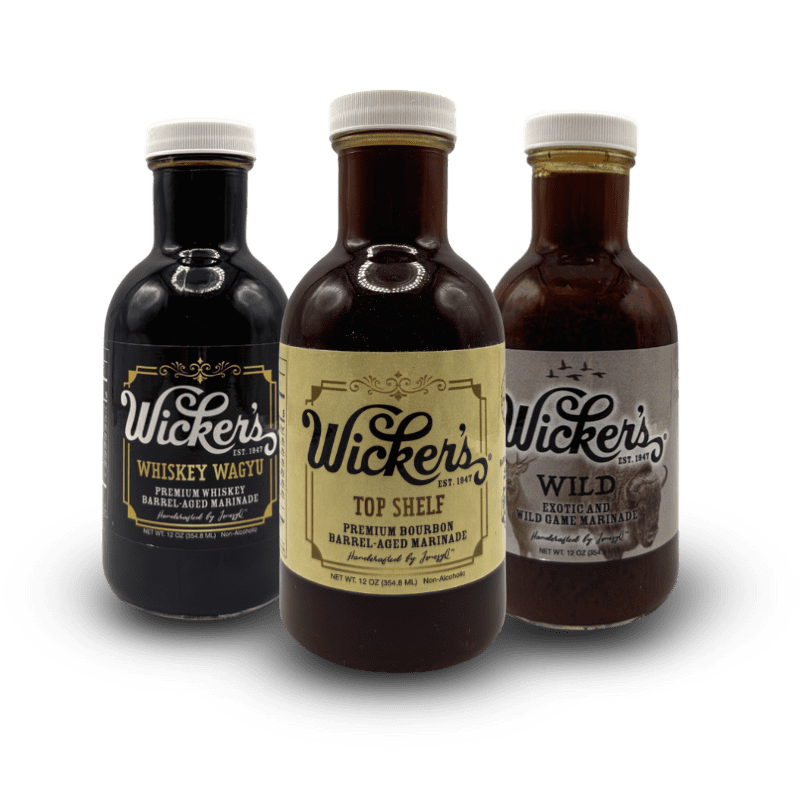 A bottle of Wicker's Whiskey Wagyu, a bottle of Wicker's Top Shelf, and a bottle of Wicker's Wild