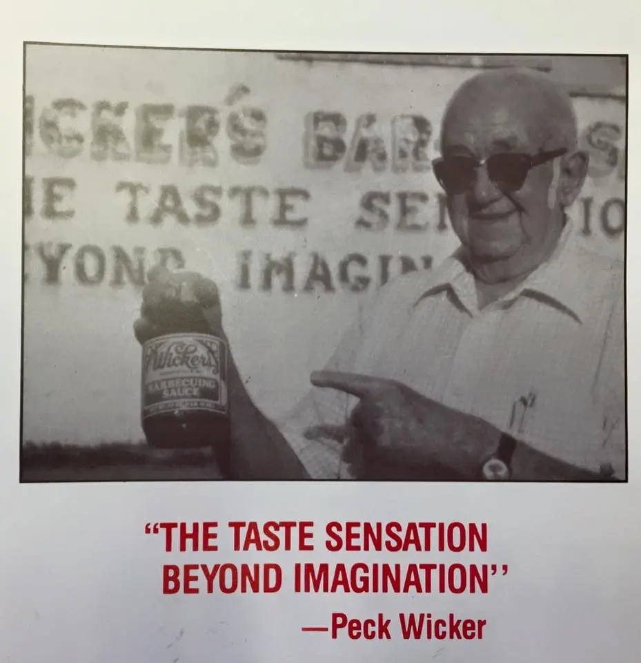 Mr. Peck, the founder of Wicker's Foods, holding a jar of Wicker's BBQ Sauce
