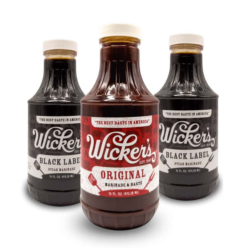 Two bottles of Wicker's Black Label behind one bottle of Wicker's Original